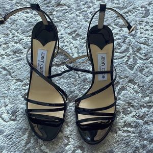 Size 38.5 (true size 8) authentic Jimmy Choo shoes. No damages or defects.
